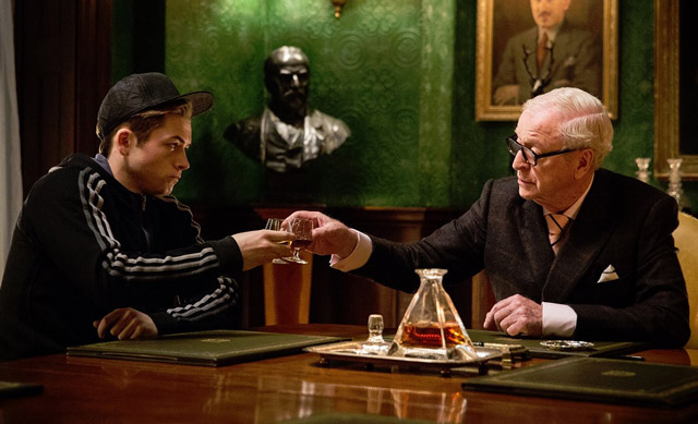 Chin-chin ... Taron Egerton and Michael Caine drink a toast in Kingsman