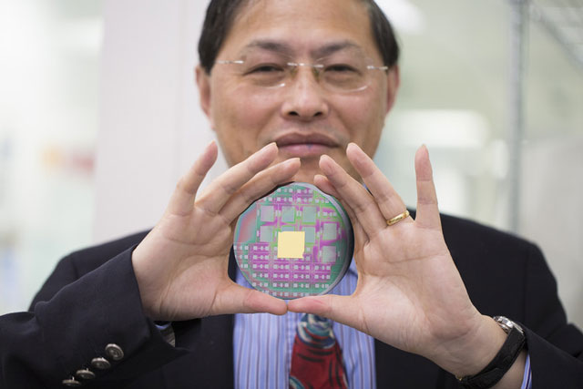Co-author Min Gu with the nanophotonic chip that can harness the angular momentum of light