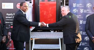 Smart ID renewals go mobile - Absa CEO Kenny Fihla with home affairs minister Leon Schreiber