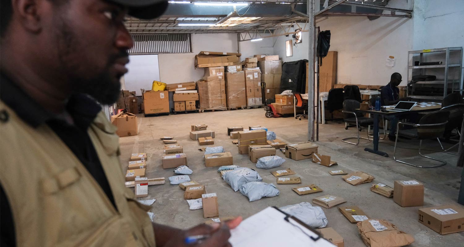 Djima Antaley organizes packages at Afrety headquarters in Dakar, Senegal. Ricci Shryock/Reuters