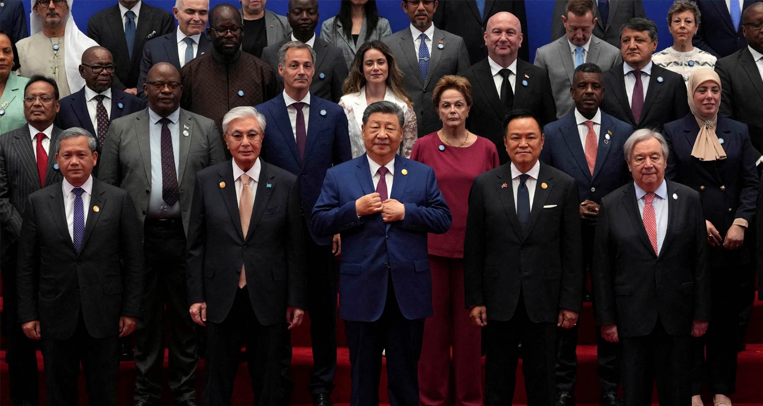 Xi Jinping stands for a group photo before the opening ceremony for the World AI Conference in Shanghai. Ng Han Guan/Reuters