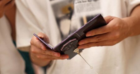 Huawei Mate XT2 tri-fold smartphone shown open at the Huawei launch event